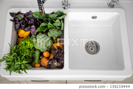 Bright washed vegetables in the kitchen sink top view. 138219444