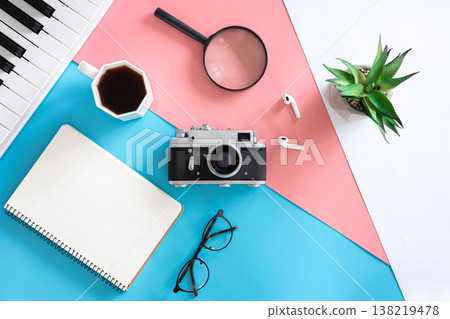 Vintage retro camera on a colored background, flat lay, minimalism. Vintage retro camera on a colored background, flat lay, minimalism. 138219478