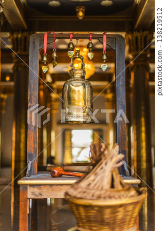 Golden Temple Bell With Wooden Mallet And Incense Inside Buddhist Shrine Thailand Golden Temple Bell With Wooden Mallet And Incense Inside Buddhist Shrine Thailand 138219512