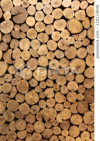 Wall of stacked wooden logs as background. Wall of stacked wooden logs as background. 138219646
