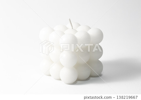 White candle square shape on a white background isolated. White candle square shape on a white background isolated. 138219667