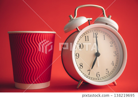White stylish alarm clock and paper cup, morning concept. 138219695