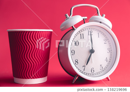 White stylish alarm clock and paper cup, morning concept. White stylish alarm clock and paper cup, morning concept. 138219696