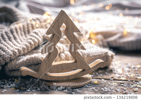 Wooden Christmas tree on a blurred background with lights. 138219806