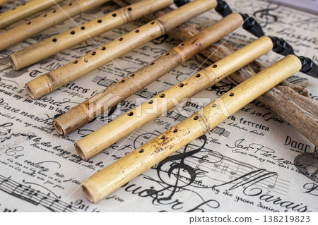 Woodwind musical instrument, handmade wooden saxophone, workshop. Woodwind musical instrument, handmade wooden saxophone, workshop. 138219823