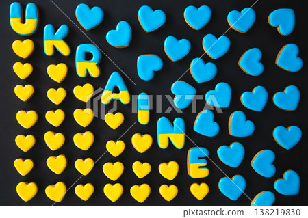 The word Ukraine on a black background, made with handmade gingerbread. 138219830