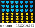 Yellow and blue handmade gingerbread cookies in the shape of hearts. 138219843