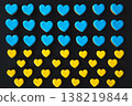 Yellow and blue handmade gingerbread cookies in the shape of hearts. 138219844