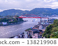 Morning view of the Ondo Bridge from the Kurahashi Island side, with the ferry boat Asahiyo Maru 1 passing through the Ondo Strait. Kure City, Hiroshima Prefecture. Morning view of the Ondo Bridge from the Kurahashi Island side, with the ferry boat Asahiyo Maru 1 passing through the Ondo Strait. Kure City, Hiroshima Prefecture. 138219908