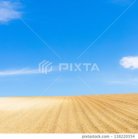 A refreshing spring scene of tilled fields in Biei, Hokkaido. A refreshing spring scene of tilled fields in Biei, Hokkaido. 138220354