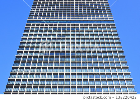 Abstract geometric patterns on the window grille facade of an office building Abstract geometric patterns on the window grille facade of an office building 138220422