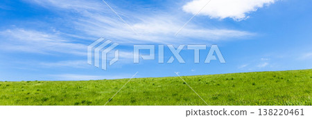 A simple landscape of refreshing early summer blue skies and the grasslands of Biei, Hokkaido. A simple landscape of refreshing early summer blue skies and the grasslands of Biei, Hokkaido. 138220461
