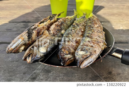 the process of roasting juicy and spiced fresh mackerel on a grill, mackerel on coals on a grill recipe the process of roasting juicy and spiced fresh mackerel on a grill, mackerel on coals on a grill recipe 138220922
