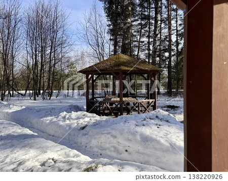 wooden gazebos for barbecue in the forest park in winter on a sunny day wooden gazebos for barbecue in the forest park in winter on a sunny day 138220926