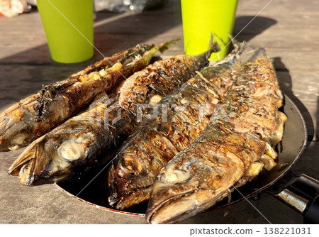 the process of roasting juicy and spiced fresh mackerel on a grill, mackerel on coals on a grill recipe the process of roasting juicy and spiced fresh mackerel on a grill, mackerel on coals on a grill recipe 138221031