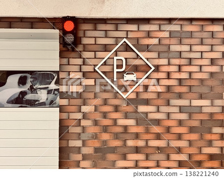 parking sign on the facade of a modern apartment building against a brick wall parking sign on the facade of a modern apartment building against a brick wall 138221240