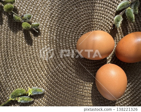 still life with Easter eggs and willow branches, consecrated by the sun 138221326