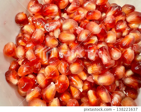 peeled juicy red pomegranate 138221637