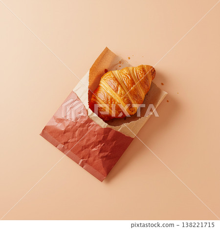 Tasty croissant in paper bag 138221715