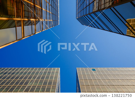 Abstract low angle view of modern glass skyscraper facades 138221750