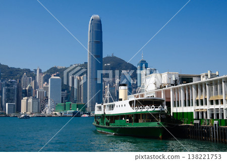 Green Star Ferry boat on Victoria Harbour Pier with Hong Kong island skyline background Green Star Ferry boat on Victoria Harbour Pier with Hong Kong island skyline background 138221753