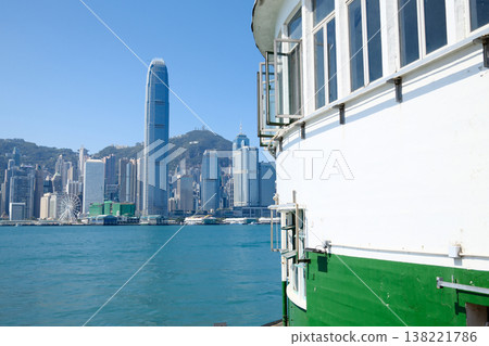 Hong Kong island skyline viewed from Star Ferry pier terminal waterfront on sunny day Hong Kong island skyline viewed from Star Ferry pier terminal waterfront on sunny day 138221786