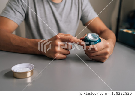 Man hands opening jar of skincare cream for daily grooming routine, focusing on self-care, beauty, and moisturizing for healthy skin, close-up, closeup. Concept of male grooming, beauty. Man hands opening jar of skincare cream for daily grooming routine, focusing on self-care, beauty, and moisturizing for healthy skin, close-up, closeup. Concept of male grooming, beauty. 138222829