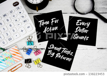 Time For Action, Small Tasks Big Returns, Every Dollar Counts text written on paper note with calculator and magnifying glass on wooden background Time For Action, Small Tasks Big Returns, Every Dollar Counts text written on paper note with calculator and magnifying glass on wooden background 138223453