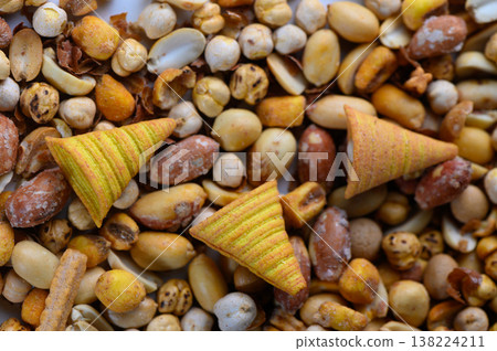 Colorful crunchy treats mixed with an assortment of nuts and seeds create a vibrant snack medley on a sunny afternoon 138224211