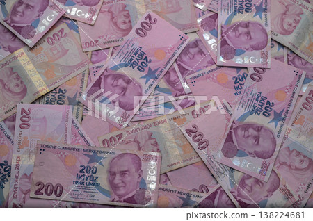 Colorful banknotes scattered across a surface create a vibrant tapestry currency 138224681