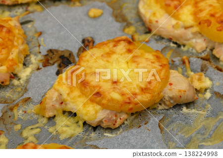 Delicious chicken topped with melted cheese and pineapple, ready for a tropical Delicious chicken topped with melted cheese and pineapple, ready for a tropical 138224998