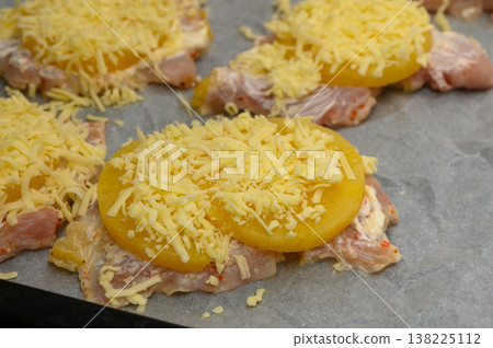 Juicy chicken breasts topped with pineapple and melted cheese ready Juicy chicken breasts topped with pineapple and melted cheese ready 138225112