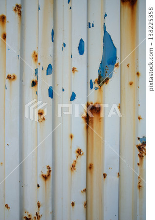 Decay and beauty unite on an old metal facade on a sunny afternoon Decay and beauty unite on an old metal facade on a sunny afternoon 138225358