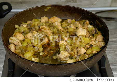 Close-Up of a Pan with Chicken and Zucchini Stir-Fry on the Stove. Cooking Detailing. 138225434