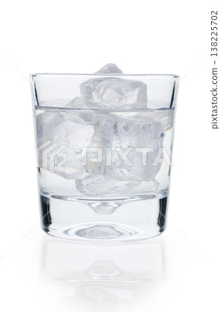 Transparent Glass with Icy Water on Clean White Background Transparent Glass with Icy Water on Clean White Background 138225702