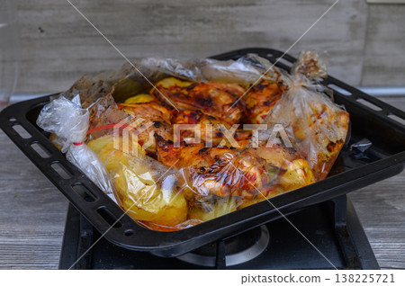 Oven-Baked Chicken Thighs with Potatoes 138225721