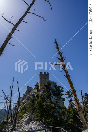 Medieval watchtower of St. Hilarion Castle rising above the mountains of Northern Cyprus. A historic symbol of defense and ancient architecture 138225949