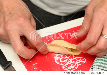 Crafting traditional dumplings in a cozy kitchen on a rainy afternoon brings warmth and comfort to the soul Crafting traditional dumplings in a cozy kitchen on a rainy afternoon brings warmth and comfort to the soul 138226034