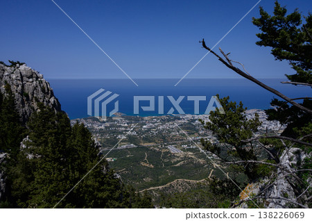 View from ancient Saint Hilarion Castle overlooking Kyrenia city and the vast blue sea. A perfect blend of history and nature. 138226069