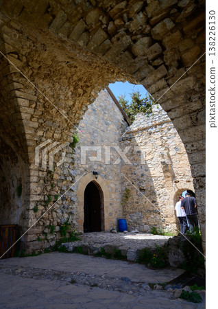 Old stone staircase inside St. Hilarion Castle leading to upper levels. Medieval fortress atmosphere. Old stone staircase inside St. Hilarion Castle leading to upper levels. Medieval fortress atmosphere. 138226130