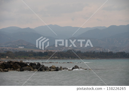 Twilight seascape with mountains and beach in Cyprus Twilight seascape with mountains and beach in Cyprus 138226265