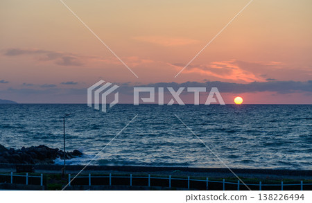 The sun dips into the Mediterranean Sea off the coast of Cyprus, painting the sky with vibrant orange and red hues in a breathtaking evening view. The sun dips into the Mediterranean Sea off the coast of Cyprus, painting the sky with vibrant orange and red hues in a breathtaking evening view. 138226494