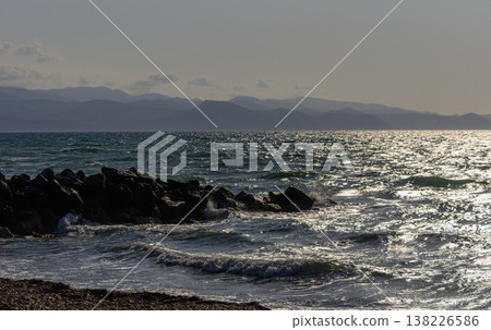 Beautiful Mediterranean seashore in Cyprus with waves crashing on cliffs under the bright sun and blue sky. 138226586