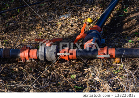 Plastic Water Pipes with T-Joint in Garden Plastic Water Pipes with T-Joint in Garden 138226832