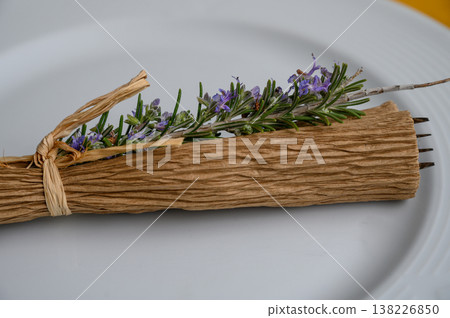 Elegant dining presentation with natural decor featuring herbs and flowers Elegant dining presentation with natural decor featuring herbs and flowers 138226850
