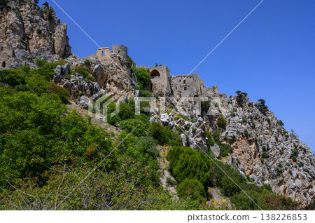 St. Hilarion Castle surrounded by spring greenery in 2025, with its stone towers rising above the Northern Cyprus landscape. 138226853