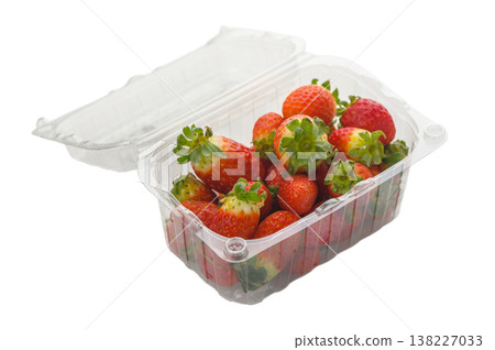 Plastic container with fresh strawberries on white 138227033