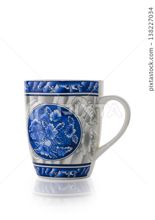 Ceramic mug with blue and white floral pattern Ceramic mug with blue and white floral pattern 138227034