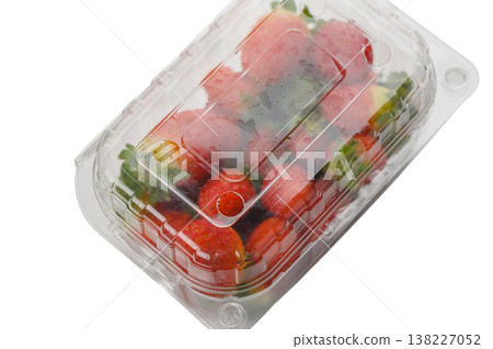 Fresh strawberries in plastic container on white background Fresh strawberries in plastic container on white background 138227052