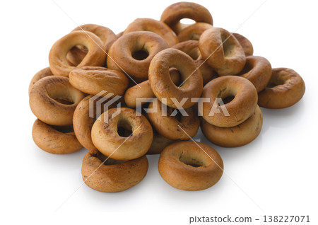 Heap of traditional Russian sushki on white background Heap of traditional Russian sushki on white background 138227071